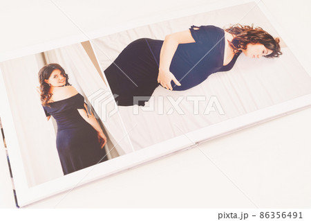the pages of a photobook with a beautiful pregnancy photo shoot. the pages of a photobook with a beautiful pregnancy photo shoot. 86356491