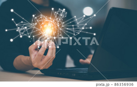 Businessman holding a bright light bulb, creativity with light bulbs and energy power, hand of a man with a light bulb and line light icon and using a notebook computer, technology innovation idea Businessman holding a bright light bulb, creativity with light bulbs and energy power, hand of a man with a light bulb and line light icon and using a notebook computer, technology innovation idea 86356936