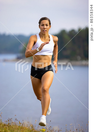 Athlete Sprinting High-Intensity Intervall Workout in Beautilful Nature Athlete Sprinting High-Intensity Intervall Workout in Beautilful Nature 86358344