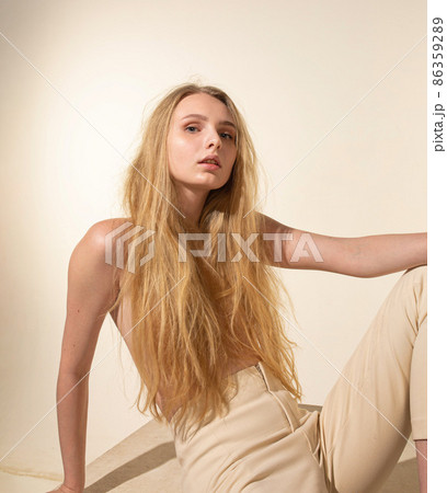 White young european woman isolated on beige White young european woman isolated on beige 86359289