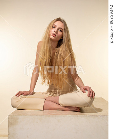 White young european woman isolated on beige 86359342