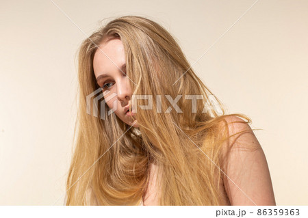White young european woman isolated on beige White young european woman isolated on beige 86359363