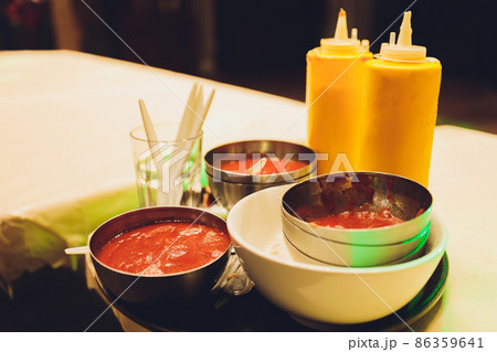 Fresh condiments and sauces on wooden background, closeup. 86359641