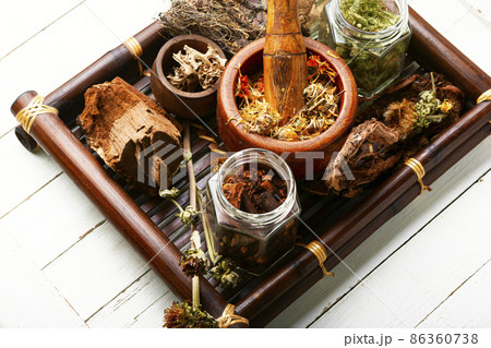 Tray with healing herbs. 86360738