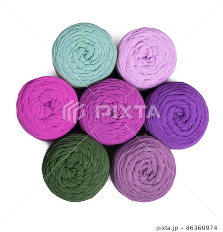 Colorful macrame yarns isolated on white background. Flat lay of natural cotton macrame yarn rolls 86360974
