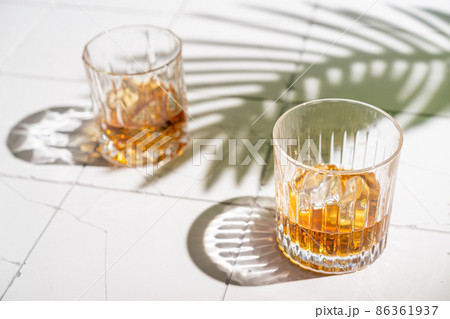 Whiskey with ice in glasses Whiskey with ice in glasses 86361937