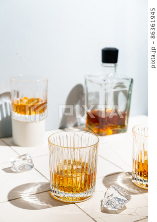 Whiskey with ice in glasses Whiskey with ice in glasses 86361945
