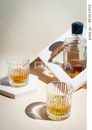 Whiskey with ice in glasses 86361950