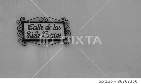An antique tile plaque naming the street calle de las siete cruces, in Quito, Ecuador An antique tile plaque naming the street calle de las siete cruces, in Quito, Ecuador 86363350