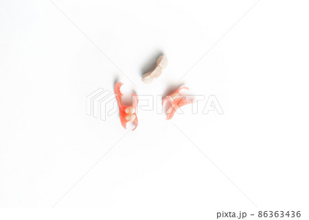 Dental prosthetics on a white background. Dentures. Dentistry. Prosthetic teeth. Dental plates. Artificial teeth. Prosthetic dentistry. Set of dentures on a white background. Copy space Dental prosthetics on a white background. Dentures. Dentistry. Prosthetic teeth. Dental plates. Artificial teeth. Prosthetic dentistry. Set of dentures on a white background. Copy space 86363436