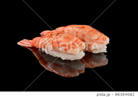 Two shrimp nigiri sushi on black background with reflection Two shrimp nigiri sushi on black background with reflection 86364082
