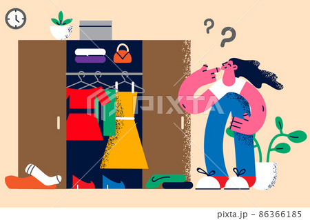 Pensive woman look in wardrobe thinking about clothes Pensive woman look in wardrobe thinking about clothes 86366185