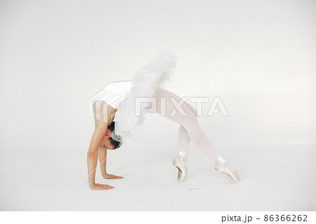 Ballerina posing in front of white background 86366262