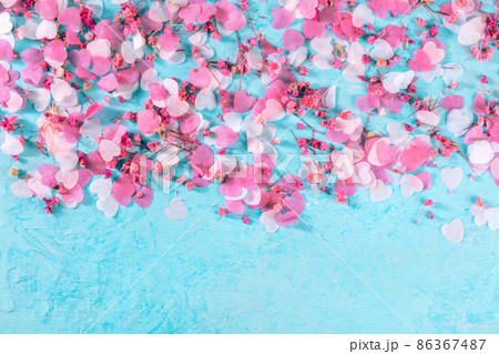 Valentine day or wedding background with hearts confetti on blue Valentine day or wedding background with hearts confetti on blue 86367487