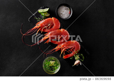 Top view of prawns with seasonings, lime, garlic sauce 86369698