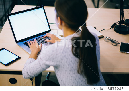 Faceless woman using computer and tablet Faceless woman using computer and tablet 86370874