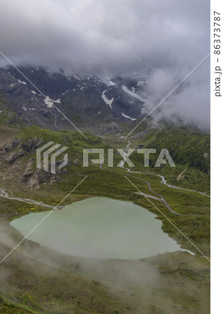 Typical alpine landscape of Swiss Alps with Steinsee, Urner Alps, Canton of Bern, Switzerland 86373787