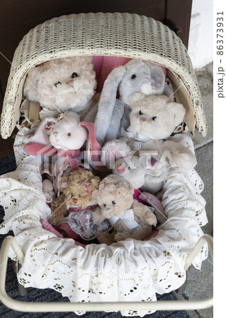 stuffed toys in the old fashioned buggy 86373931