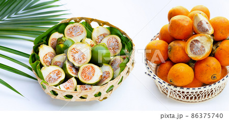 Chewing betel nut, Betel nut with cal lime powder on betel leaves 86375740