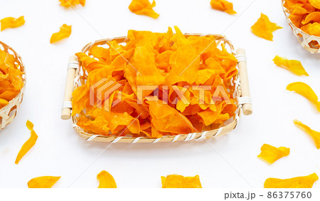 Sweet potato chips in bamboo basket on white background. Sweet potato chips in bamboo basket on white background. 86375760