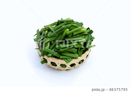 Fresh Chinese Chive leaves on white background. 86375795