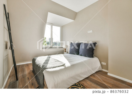 Beautiful bedroom in new luxury home with some decor Beautiful bedroom in new luxury home with some decor 86376032