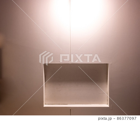 Directly beneath a attic access door looking up at the ceiling Directly beneath a attic access door looking up at the ceiling 86377097