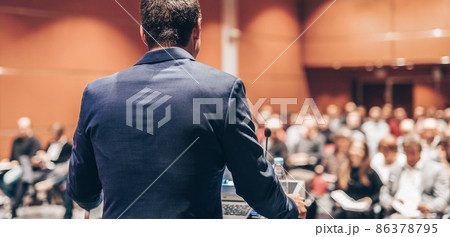 Public speaker giving talk at Business Event. 86378795