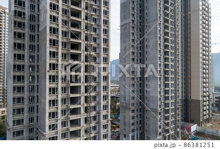 Aerial view of multistory apartment construction site in China Aerial view of multistory apartment construction site in China 86381251