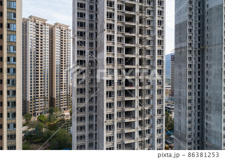 Aerial view of multistory apartment construction site in China Aerial view of multistory apartment construction site in China 86381253