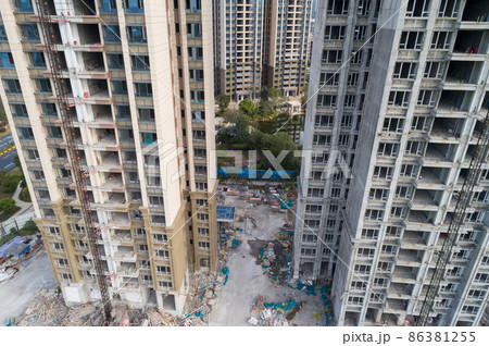 Aerial view of multistory apartment construction site in China Aerial view of multistory apartment construction site in China 86381255