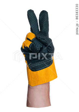 Hand in construction glove. Two fingers up. Symbol or sign. Object for colossing. Isolated on white Hand in construction glove. Two fingers up. Symbol or sign. Object for colossing. Isolated on white 86383330