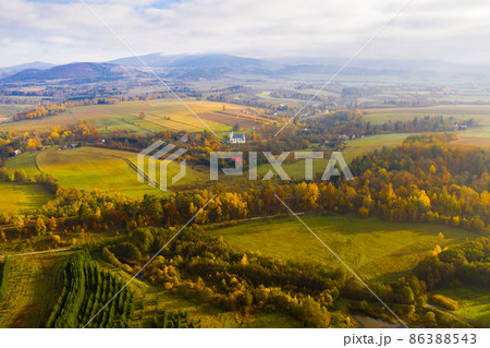 Picturesque autumn view with church on a hill Picturesque autumn view with church on a hill 86388543