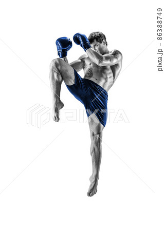Full length of kickboxer in blue sportswear who fighting on white background. Black and white  86388749