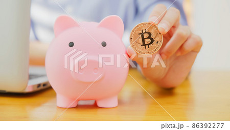 businesswoman holding bitcoin 86392277
