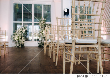 A place for a wedding ceremony in the interior. Decorated wedding venue 86393102