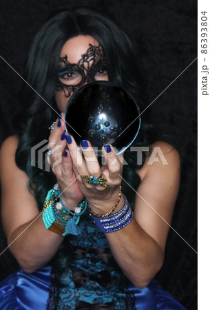 Woman in Blue Corset With Crystal Ball Woman in Blue Corset With Crystal Ball 86393804