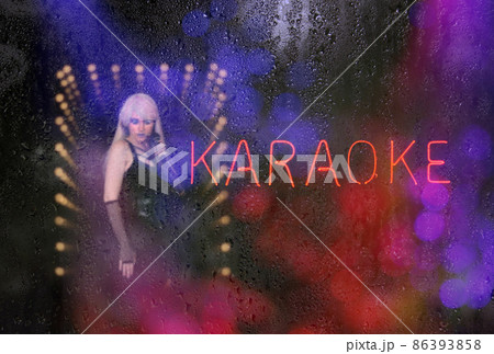 Neon Karaoke Sign with wet window, Focus on Sign Neon Karaoke Sign with wet window, Focus on Sign 86393858