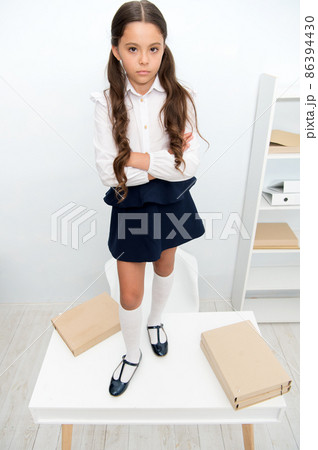 Schoolgirl concept. Schoolgirl do not want to go to school Schoolgirl concept. Schoolgirl do not want to go to school 86394430