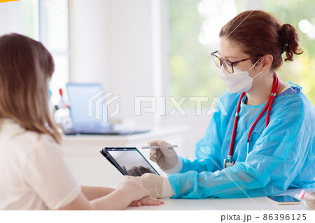 Doctor examining sick patient. Ill woman in clinic 86396125