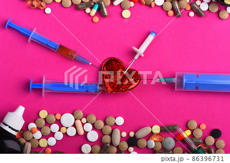 Set of colorful pills scattered on pink background. Set of colorful pills scattered on pink background. 86396731