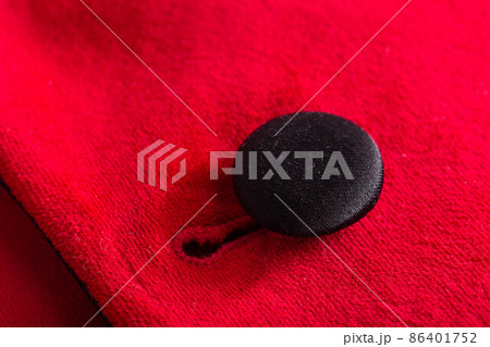 Red stylish jacket with buttons, background. Stylish clothes, macro, elegant Red stylish jacket with buttons, background. Stylish clothes, macro, elegant 86401752