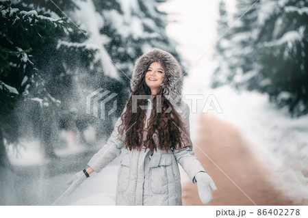 happy young woman in red hat in winter. toned photo 86402278