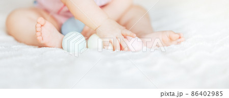 Cute little baby girl, playing with colorful easter eggs 86402985