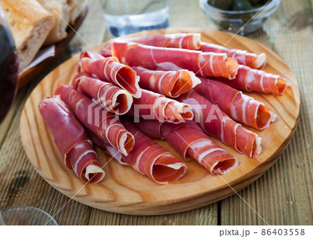 Rolled up slices of dry-cured ham Rolled up slices of dry-cured ham 86403558