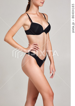 gorgeous slim woman with perfect body in black underwear gorgeous slim woman with perfect body in black underwear 86404165