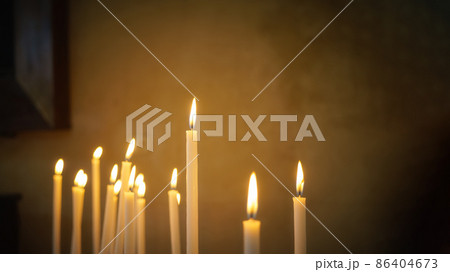 some typical candles in a church with space for your text 86404673