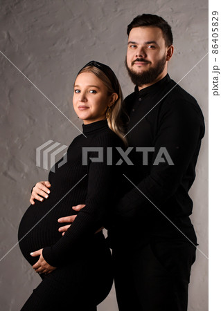Portrait of a loving couple expecting a baby Portrait of a loving couple expecting a baby 86405829