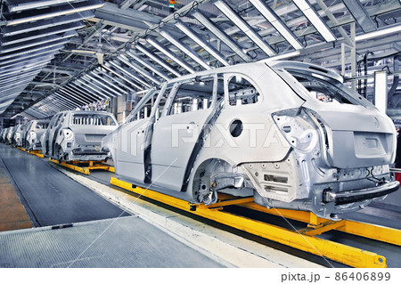 cars in a row at car plant 86406899