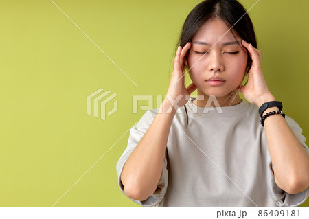 asian woman suffering from headache desperate and stressed because pain and migraine 86409181